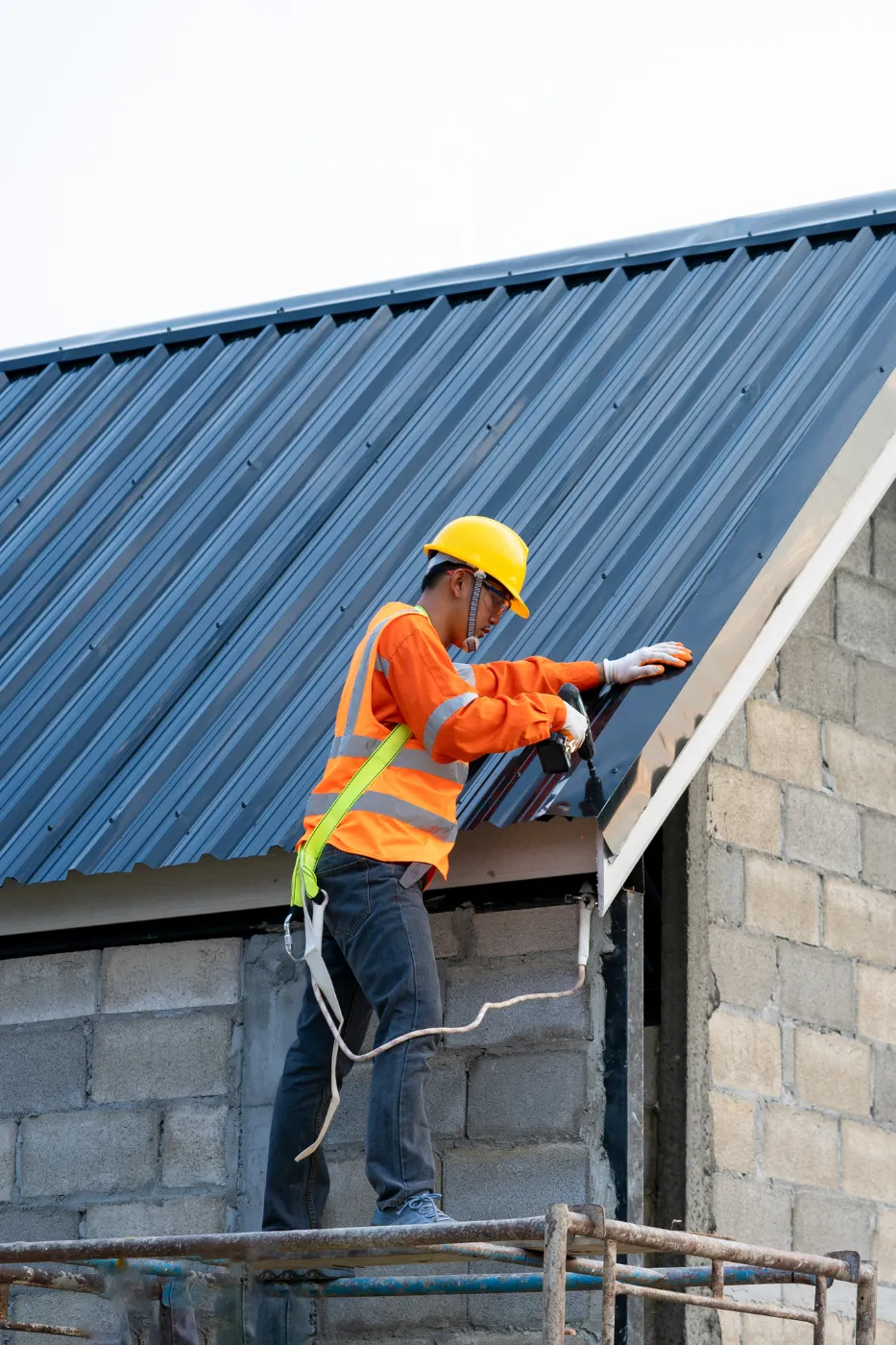 Roofing contractor reviewing campaign performance on a tablet at a job site